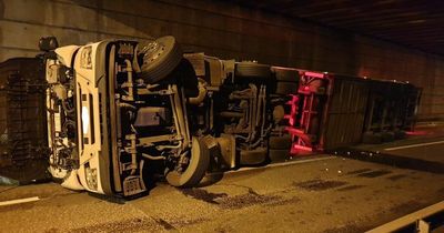Man arrested on suspicion of drug driving after motorway link road closed for hours after lorry overturns