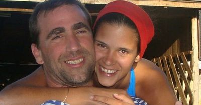 Tourist dies after she's swept out to sea by massive wave while taking a picture