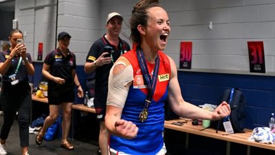 Daisy Pearce revels in AFLW premiership with Melbourne, putting thoughts of retirement on the backburner