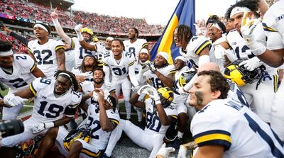 Michigan Football Team Takes the Ice During Hockey Game