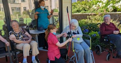 Edinburgh pensioners roll back the years with archery lessons at care home