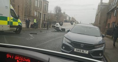 Van flips on roof after crash on Scots road as driver rushed to hospital