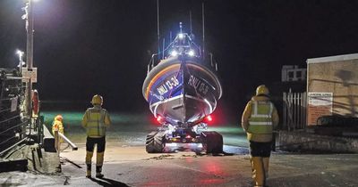 Adult and four children rescued after waters rise as high as car roof on Holy Island causeway