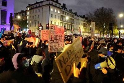 Hundreds protest China’s zero-Covid policy in London as demonstrations held around world