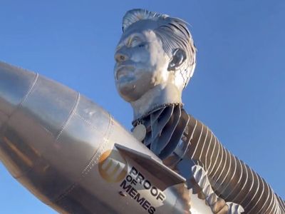 Elon Musk superfans unveil elaborate 12,000lb goat sculpture at Tesla headquarters - but he fails to accept it