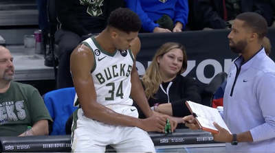 Giannis Antetokounmpo played with a toy dinosaur during a timeout and it was so adorable