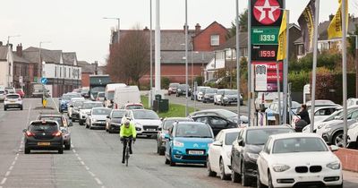 Huge queues along main road as Greater Manchester petrol station slashes prices