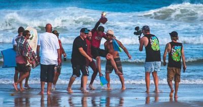 Bodyboarding champ stabbed while beach fishing: man charged
