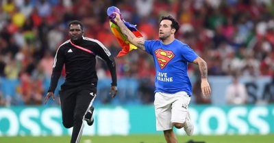 World Cup 2022: Portugal vs Uruguay halted as pitch invader storms field with rainbow flag