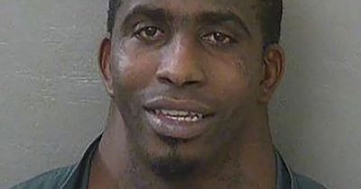 Wide-necked man whose mugshot went viral is arrested again on stalking charge