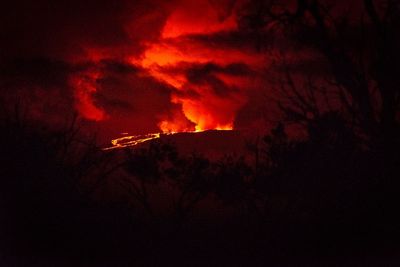 Mauna Loa eruption in pictures: 200 ft fountains of lava set Hawaiian sky ablaze in fiery glow