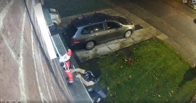 Laughing thieves seen stealing toddler's inflatable Father Christmas