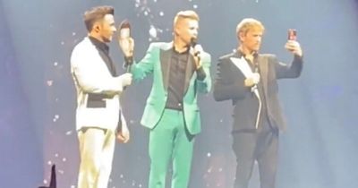 Westlife trio emotional as they pause concert to pay tribute to seriously ill Mark Feehily