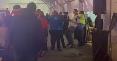 Security staff lead football fans away in disturbance at Swansea World Cup fan zone