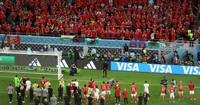 Wales players and fans stay behind to sing national anthem in stunning moment of togetherness despite World Cup exit