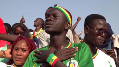 Senegal supporters rejoice as team go through to World Cup knockouts in Qatar