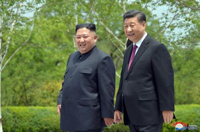 Xi tells Kim China wants to work with North Korea for peace: KCNA