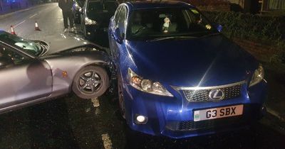 The moment a car swerves then smashes into a couple's parked Lexus on a road where residents fear a fatality