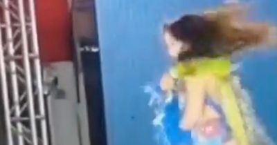 Terrifying moment beauty pageant model is electrocuted on stage after grabbing faulty mic