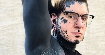 Tattooed dad with 96% of body inked shows how his fingers were turned black