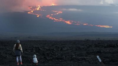 Lava from Hawaii Volcano Lights Night Sky amid Warnings