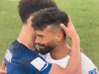 US football player lauded for hugging heartbroken Iranian opponent