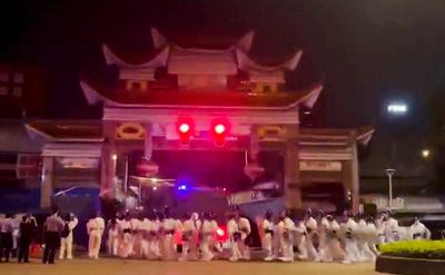 China softens COVID stance after protests, clashes with police