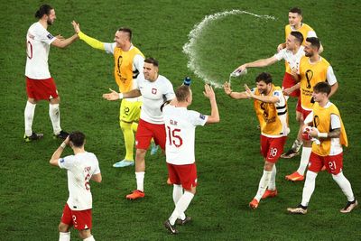 Poland revel in ‘bitter and sweet’ defeat after doing what they needed to survive