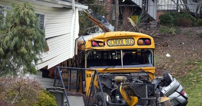 Horror as New York school bus packed with children smashes into house