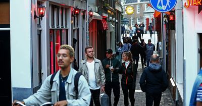 Amsterdam bids to ban pub crawls and limit cannabis as good tourists 'do not pee through the mailbox'