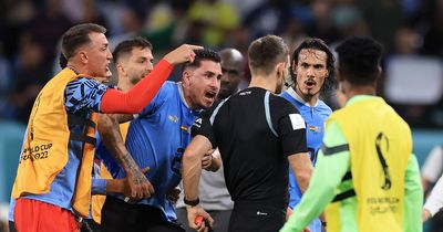 Shocking scenes unfold after Uruguay dumped out of World Cup as players hound referee over decision