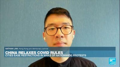 Exiled Hong Kong pro-democracy activist Nathan Law reacts to protests in China