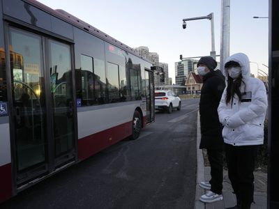 Beijing and other cities in China end required COVID-19 tests for public transit