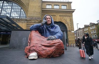 Giant hyper-real sculpture of a person experiencing homelessness unveiled at King’s Cross Station