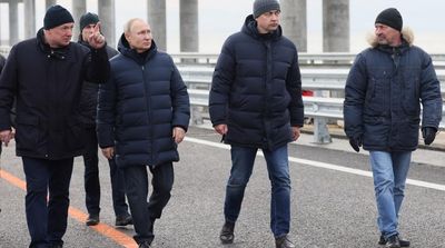 Russia’s Putin Drives across Repaired Bridge to Crimea