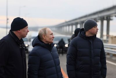 Russia's Putin drives across repaired bridge to Crimea