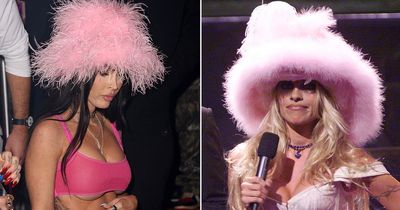 Megan Fox puts on busty display as she channels Pamela Anderson in pink fluffy hat