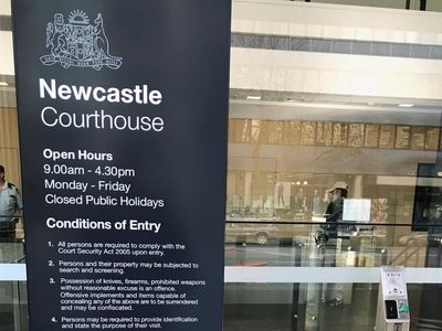 Woman charged over non-report of murder