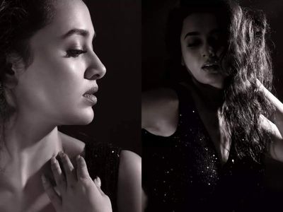 Karan Kundrra reacts to girlfriend Tejasswi Prakash's sizzling new photos in a shimmery black gown