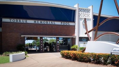 Man charged over alleged filming of child in Cairns public pool change room