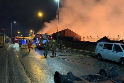 Major incident declared as 100 firefighters tackle blaze in derelict factories