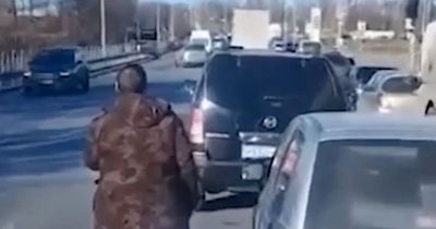 'Deserter' gunman in camouflage opens fire at police as Russian city goes into lockdown