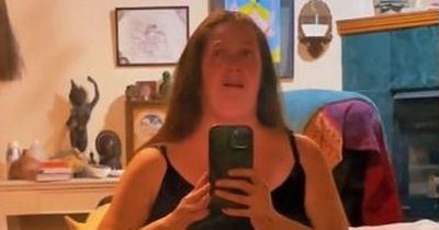 Woman who lost 26st to 'save her own life' shares video of excess skin before operation