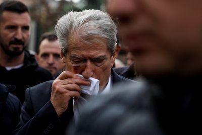 Albanian opposition leader punched in face as he marches to protest