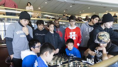 Chess tournament pairs students, cops in a safe space that lets kids ‘flex their intellectual muscles’