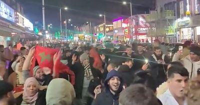 Travel chaos as hundreds of football supporters flood Manchester street after shock win for Morocco