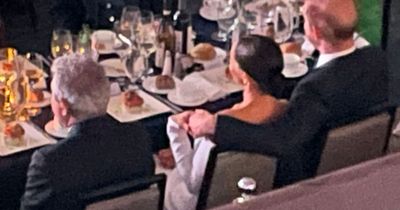 Prince Harry puts supportive arm around Meghan Markle as they accept anti-racism award