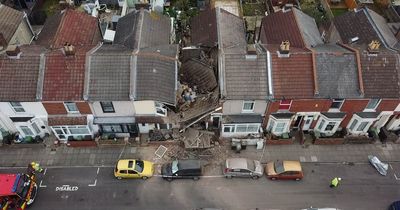 House COLLAPSES sparking mass evacuation of street as rescue crews search through rubble