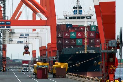 Japan's economy shrank less in July-Sept, revised data show