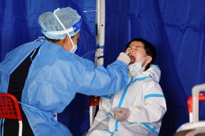 Hong Kong government eases COVID quarantine and testing regime after Beijing moves